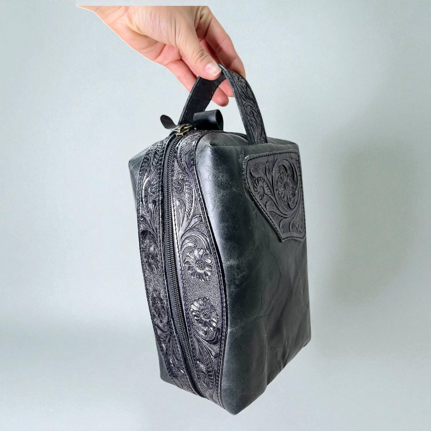 Black tooled leather toiletry bag 